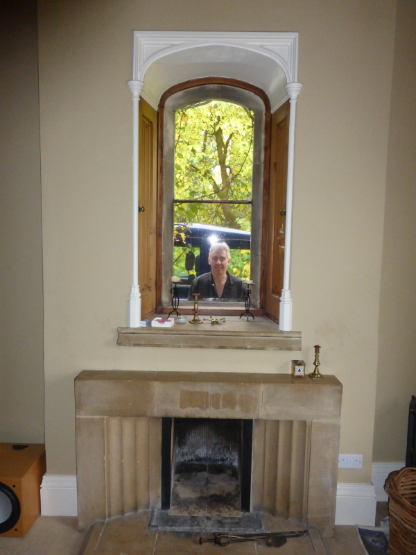 Window above fireplace